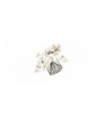White orchid in round glass bottle